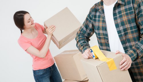 Packed moving boxes ready for flat removals in Mordenpark