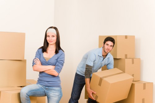 Packing boxes into a mobile storage container in Mordenpark