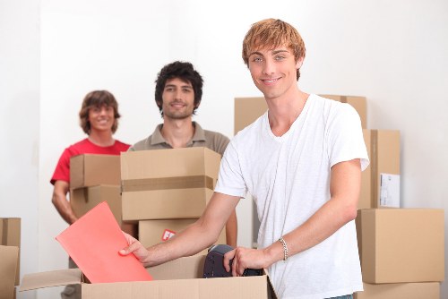 Organized home relocation with boxes and furniture in Mordenpark